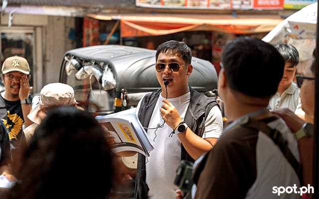 Rajee Florido reads an excerpt from The Foods of José Rizal by Felice Prudente Sta. Maria at one of the stops of the literary tour